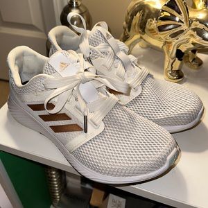 White Adidas Edge Lux size 9 1/2 with rose gold stripes. Great condition.